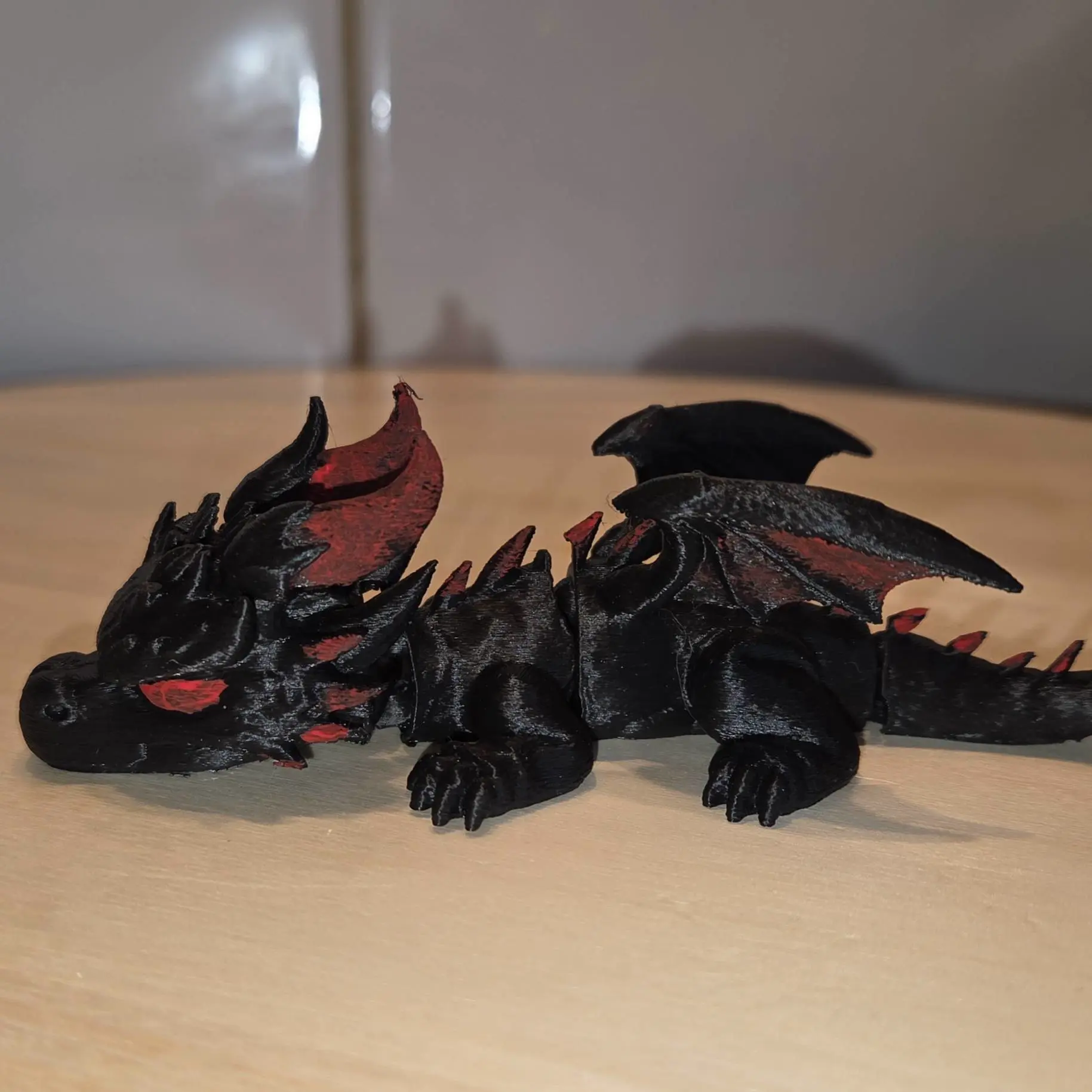 Bronvoorbeeld van het 3D-model Flexi Shadow Dragon door Byrne 3d Prints