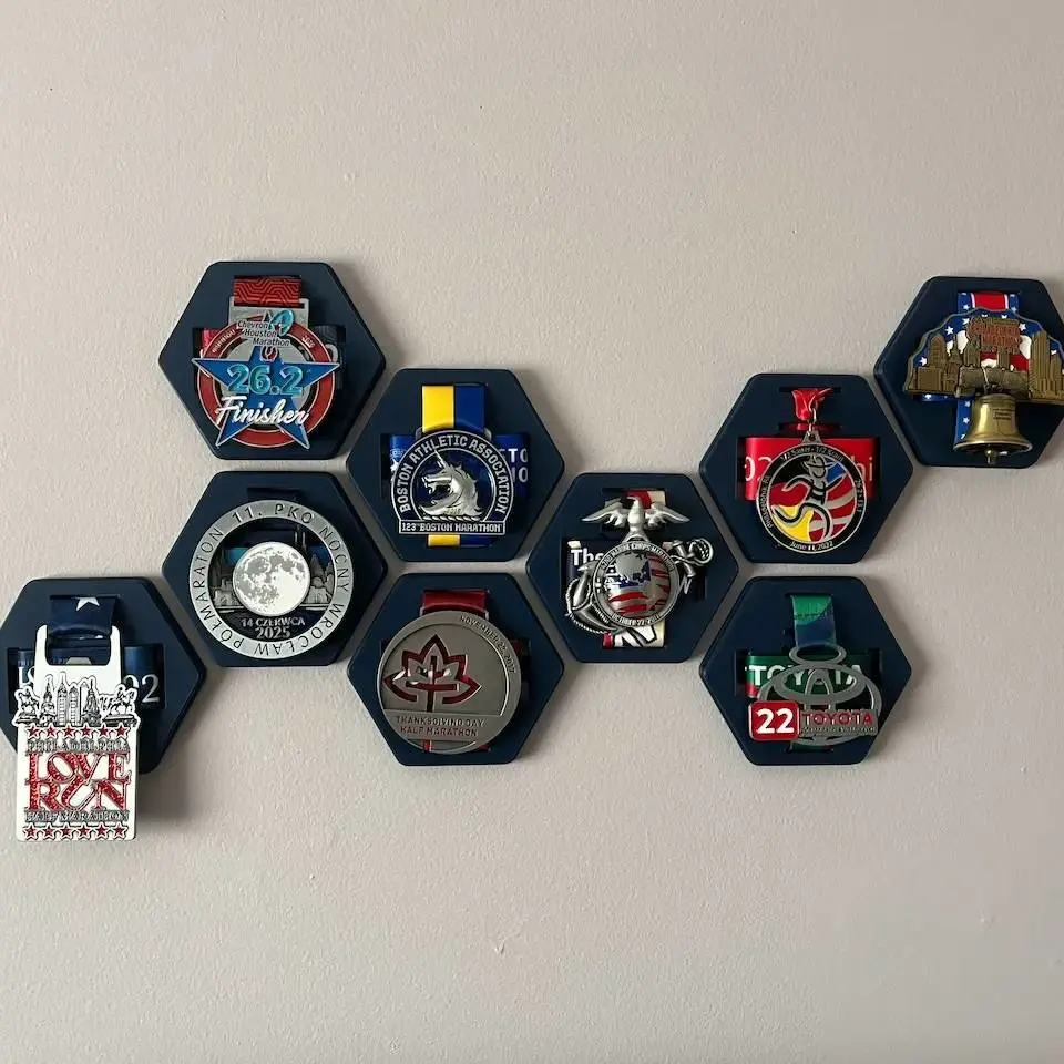 Source preview of the Race Medal Display (Hexagon Wall Mount) 3D model by Samantha Brandstater