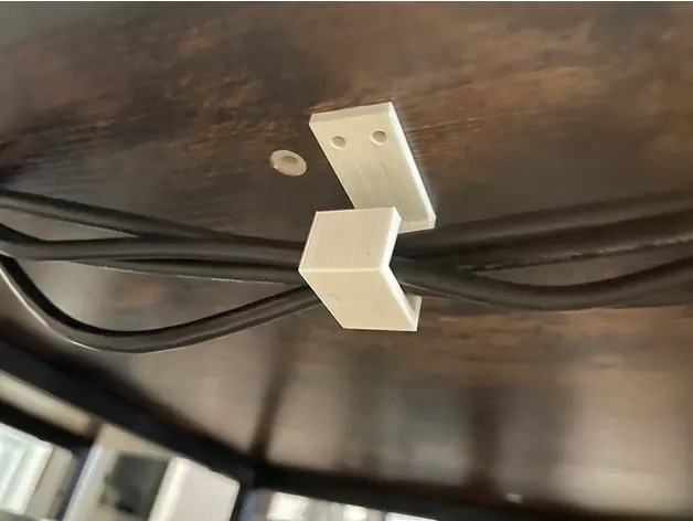 Bronvoorbeeld van het 3D-model Under the Desk Cable Holder door farid1991